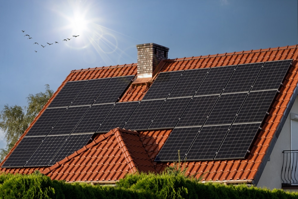 Black solar panels on a tiled roof