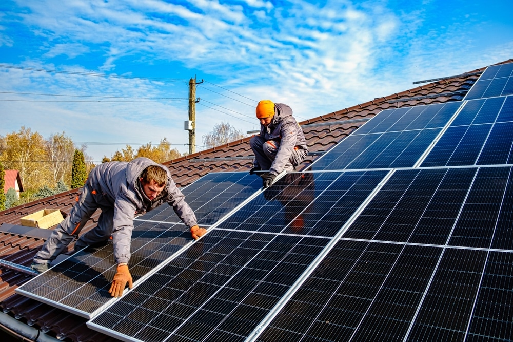 Solar panels being installed on a roof
